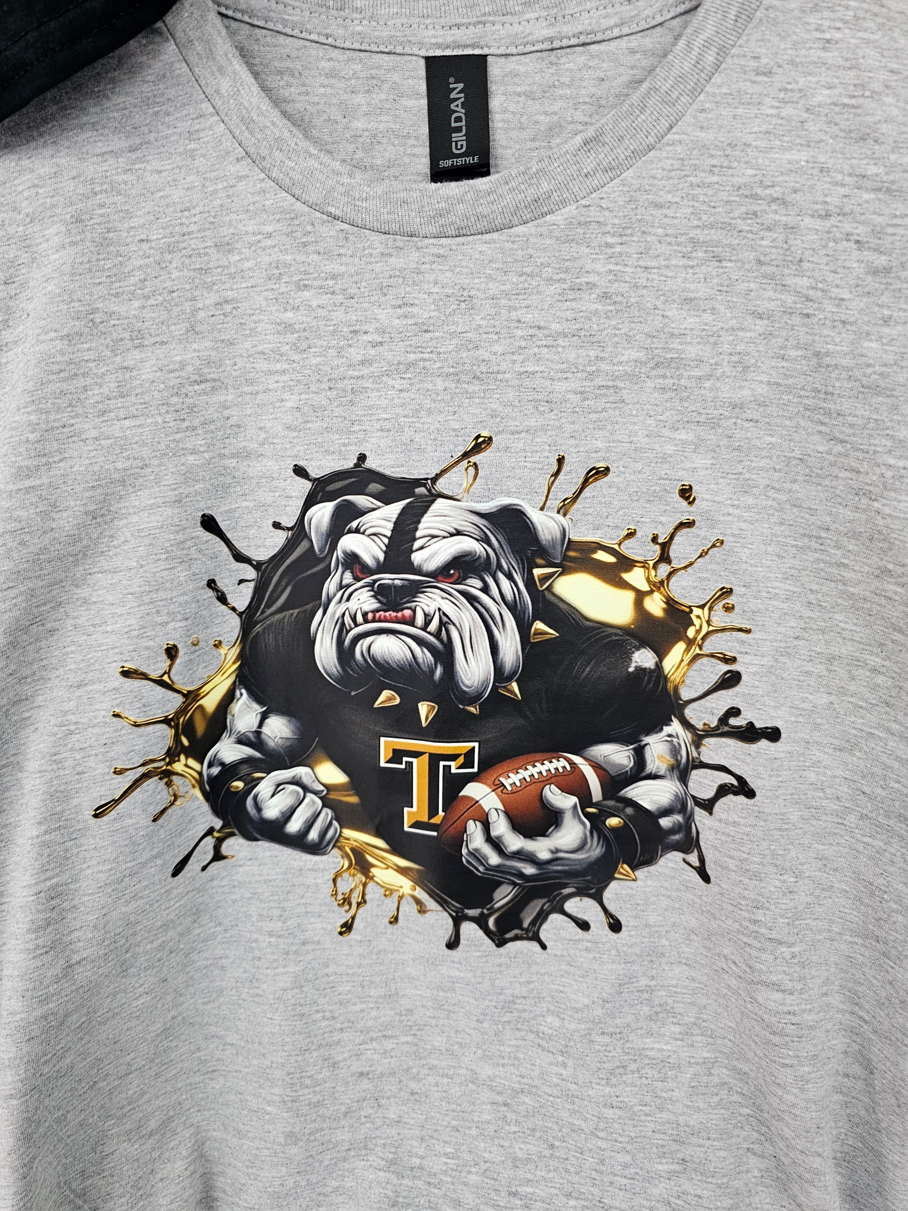 Bulldog football - tough looking bulldog holding the football - athletic wear, spirit wear