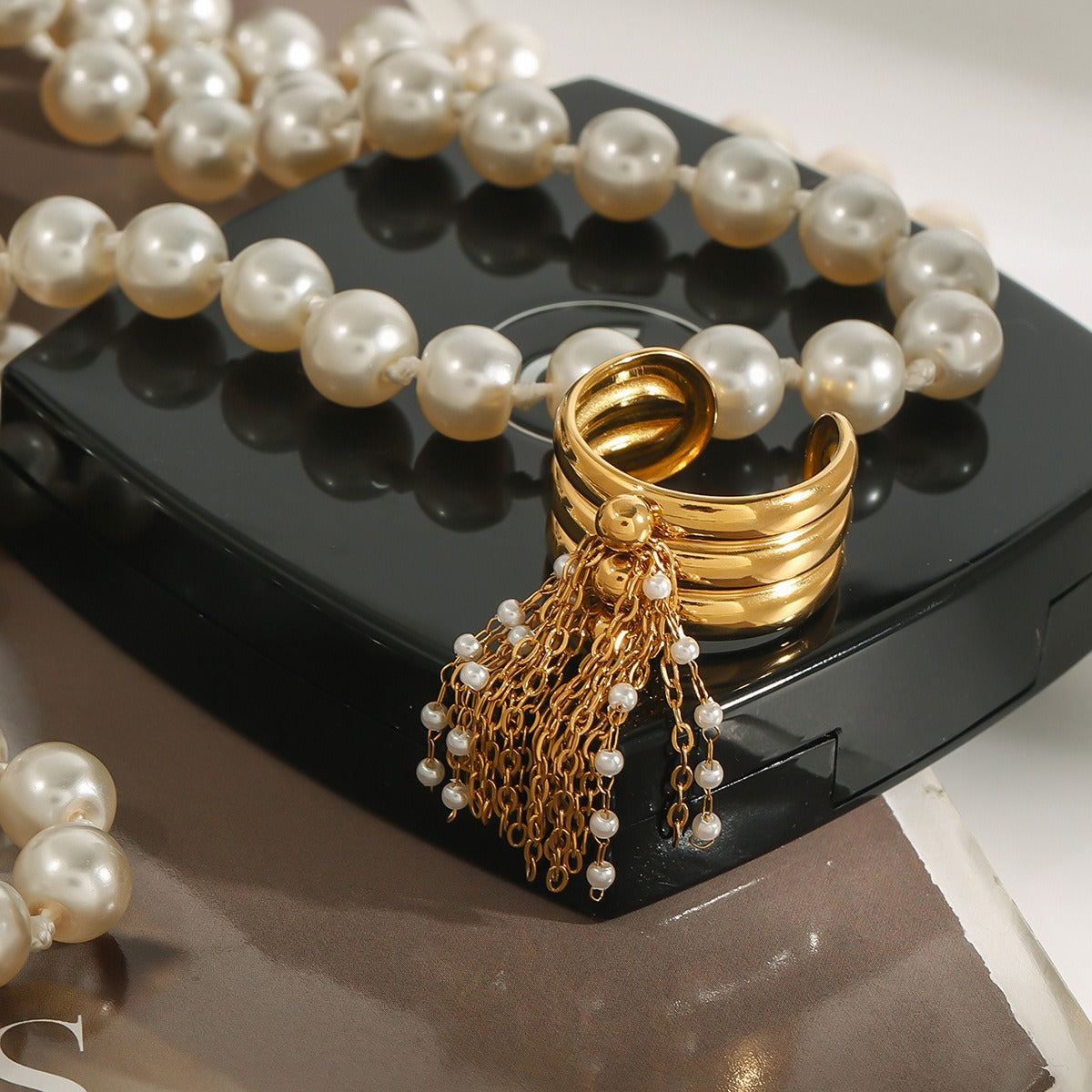 18K gold multi-layered ring with tassel design